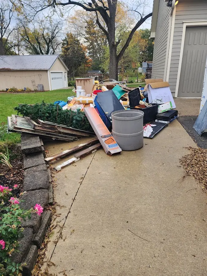 Dumpster being loaded with debris for Residential Dumpster Rental in Birmingham